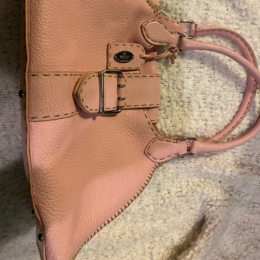 This is a Fendi Selleria bag. It’s used but in good conditions.
